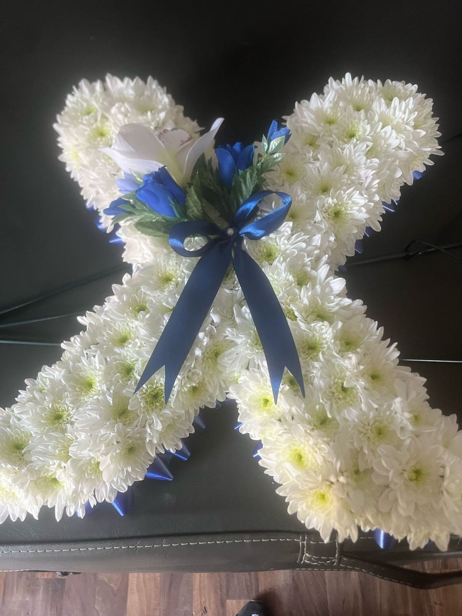 Angel wings tribute by Wright Stripes Floristry